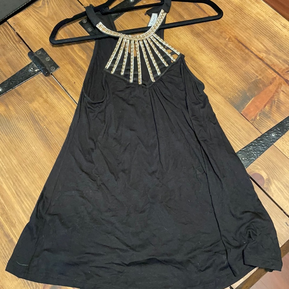 Black stretchy top with rhinestone embellishments.